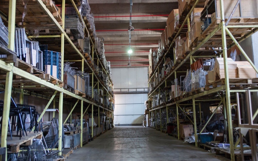 An empty aisle between warehouse racking
