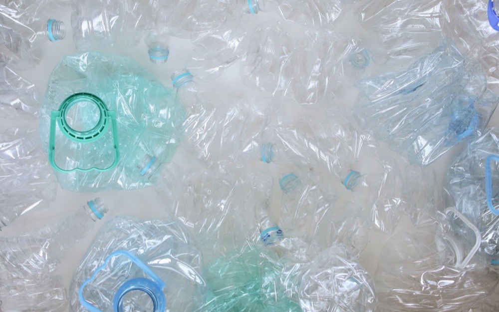 Crushed clear PET bottles baled for reprocessing